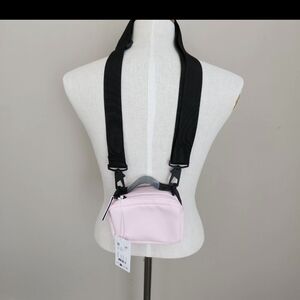 Rains Pastel Pink Mini Crossbody with Black Accent Strap